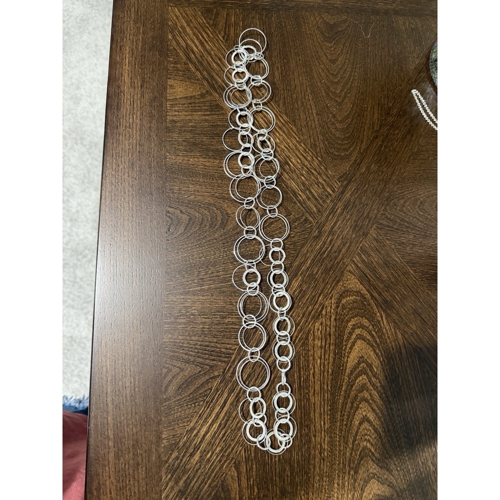 silver-tone chain link necklace made of interlocking circles